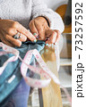 Close up of woman caucasian hands working like tailor at home - home work job activity for independent modern people 73257592