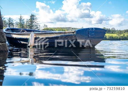 Rowing boat at the pier in Bruckless in County Donegal - Ireland. 73259810