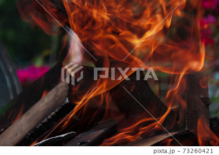 inflames the fire more covering firewood 73260421
