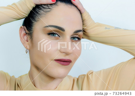Attractive woman after applying make up Attractive woman after applying make up 73264943