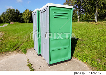 Public toilet outside in park in summer 73265872