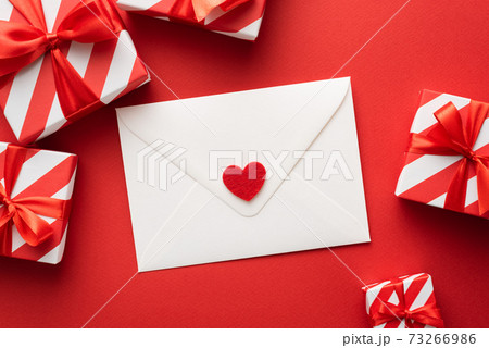 Valentine's day greeting card with gift boxes in red colors 73266986