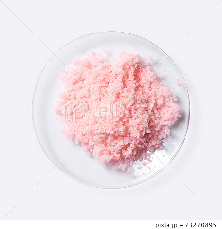 Pink flake chemicals in Chemical Watch Glass (Top View). Closeup Ornamental Plant Fertilizer Pink flake chemicals in Chemical Watch Glass (Top View). Closeup Ornamental Plant Fertilizer 73270895