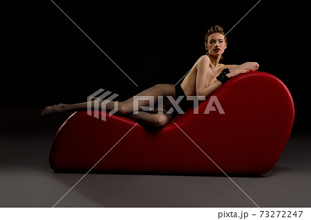 Seductive topless woman in black stockings 73272247