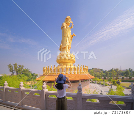 Asian woman traveling at Goddess Guan Yin Shrine, Fo Guang Shan Thaihua Temple, Bangkok City, Thailand. Holiday vacation concept. Tourist attraction landmark. 73273307