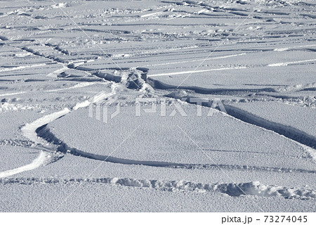Trace of ski and snowboards in new-fallen snow Trace of ski and snowboards in new-fallen snow 73274045