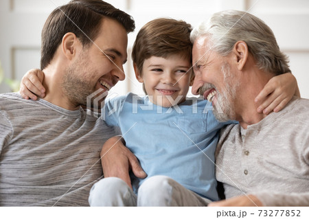 Happy three generations of men play at home Happy three generations of men play at home 73277852
