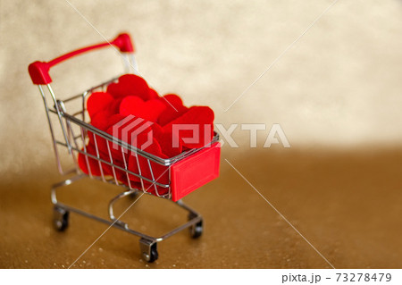 cart with hearts on gold background valentine's day cart with hearts on gold background valentine's day 73278479