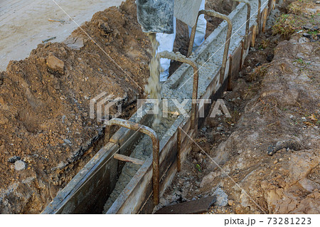Mixed concrete pouring at construction cement during sidewalk ready mixed concrete 73281223