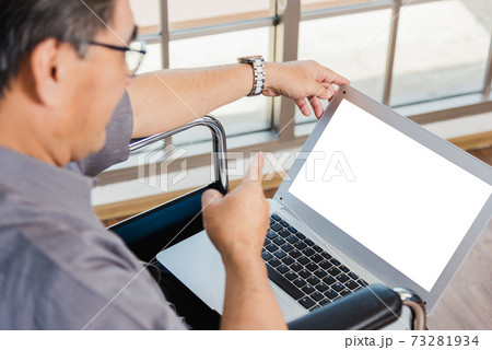 father man sitting wheelchair and his son talking video calls conference on laptop father man sitting wheelchair and his son talking video calls conference on laptop 73281934