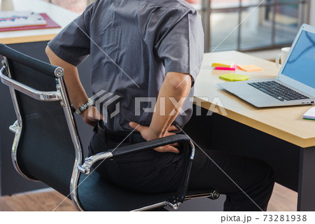 senior businessman working with laptop computer has a problem with back pain 73281938