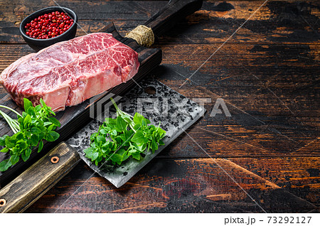 Raw Top Blade beef meat steak. Dark wooden background. Top view. Copy space Raw Top Blade beef meat steak. Dark wooden background. Top view. Copy space 73292127