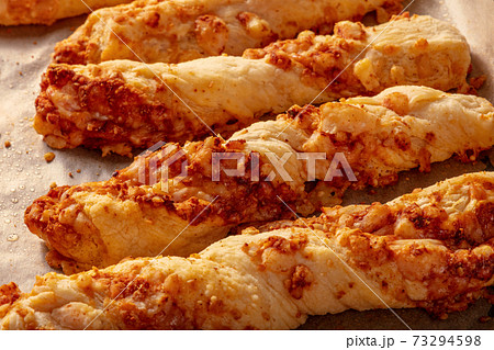 Homemade cheese straws on a baking tray Homemade cheese straws on a baking tray 73294598