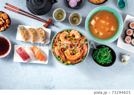 Japanese food with a place for text. Sushi, miso soup, udon, tea etc 73294625