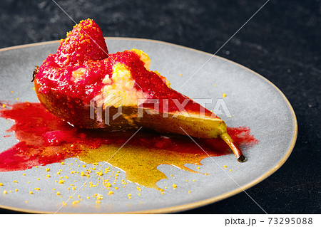 Close up view of baked pears with mascarpone, caramel syrup and strawberry jam Close up view of baked pears with mascarpone, caramel syrup and strawberry jam 73295088