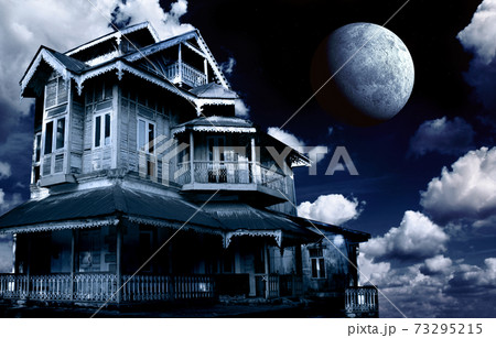 Haunted house. Old abandoned house on night sky background 73295215