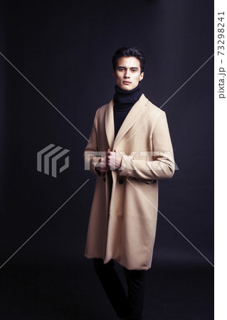 handsome asian fashion looking man posing in studio on black background, lifestyle modern people concept 73298241