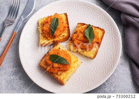 Sandwich with toast and zucchini caviar. Vegetable caviar on bread, a healthy vegetarian snack. Sandwich with toast and zucchini caviar. Vegetable caviar on bread, a healthy vegetarian snack. 73300212