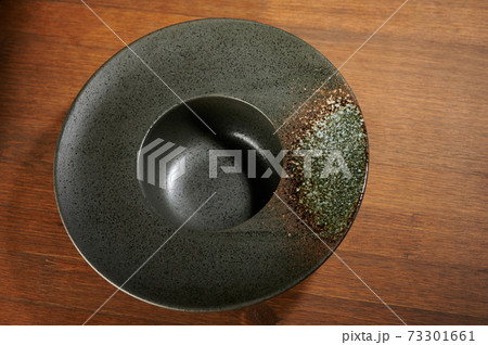 Gray empty soup plate perspective view Gray empty soup plate perspective view 73301661