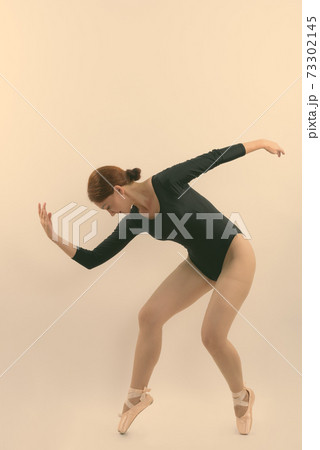 Full body shot of woman ballet dancer posing Full body shot of woman ballet dancer posing 73302145