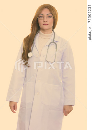 Studio shot of woman doctor standing Studio shot of woman doctor standing 73302235
