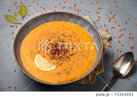 Ezogelin Soup in gray bowl on concrete table top. Turkish cuisine traditional dish 73303993