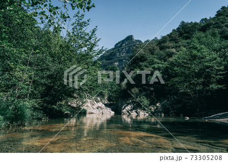 Landscape of green mountains in sadernes, catalonia Landscape of green mountains in sadernes, catalonia 73305208