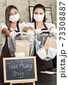 waitress wear protective face mask hold food bag 73308887