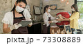Panorama Waitress with face mask take order for curbside pick up and takeout. 73308889