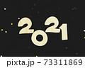 Wooden numbers 2021 on a black background. 73311869