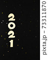 Wooden numbers 2021 on a black background. 73311870