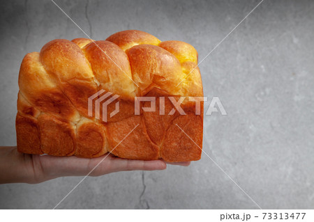Brioche is a bread of French origin that is similar to a highly enriched pastry, and whose high egg and butter content gives it a rich and tender crumb 73313477