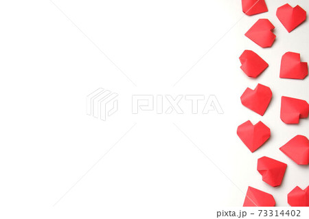 Composition from several handmade 3D red paper hearts on white background isolated. Love, Valentine's, mother's, women's day, relations, wedding, romantic template copy space Composition from several handmade 3D red paper hearts on white background isolated. Love, Valentine's, mother's, women's day, relations, wedding, romantic template copy space 73314402