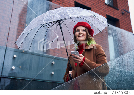 Woman standing at the stairs and looking away 73315882