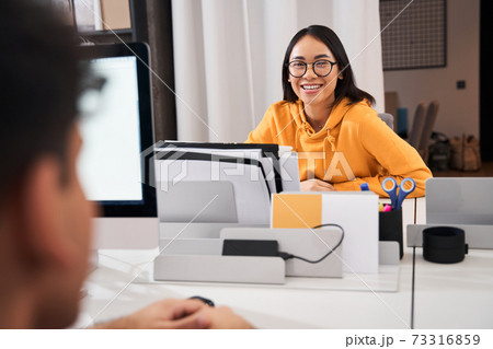 Woman wearing glasses looking at the camera 73316859