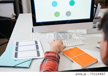 Illustrator working in creative office Illustrator working in creative office 73316887