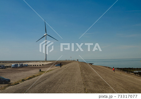 Oosterscheldekering, the netherlands, August 2019. In the Zeeland countryside, wind farms 73317077