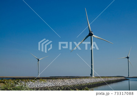 Oosterscheldekering, the netherlands, August 2019. In the Zeeland countryside, wind farms 73317088