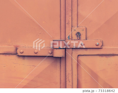 Lock case on latch and lock insert. Industrial red sheet metal doors locked Lock case on latch and lock insert. Industrial red sheet metal doors locked 73318642