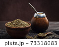 Calabas with bombilla and mate in a bowl 73318683