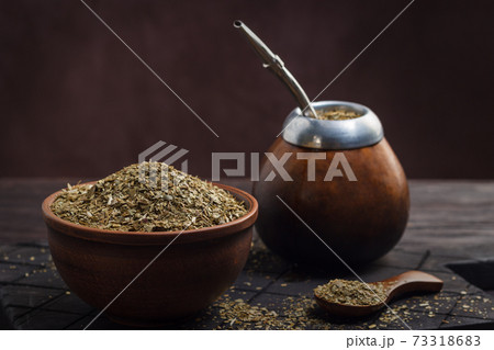 Calabas with bombilla and mate in a bowl 73318683
