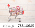 Garlic heads in a shopping cart 73318685