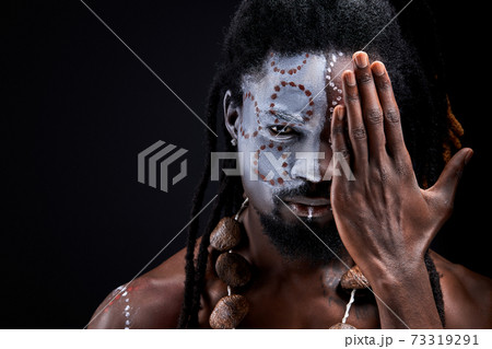 portrait of african maya man with national make-up closing half of face portrait of african maya man with national make-up closing half of face 73319291