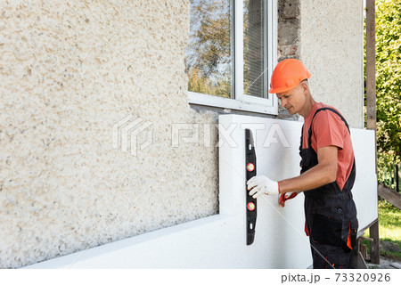 Insulation of the house with polyfoam. 73320926