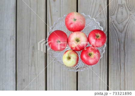 Red apples in a plate  73321890