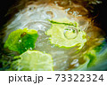 Lime in a glass of water. 73322324