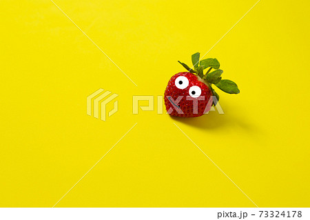 Strawberries on a yellow background. Minimal color still life photography 73324178