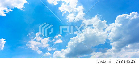 sky and clouds background,bright day light in blue sky with white fluffy clouds 73324528