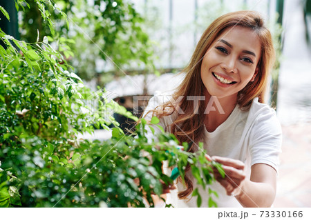 Young man in her backyard Young man in her backyard 73330166