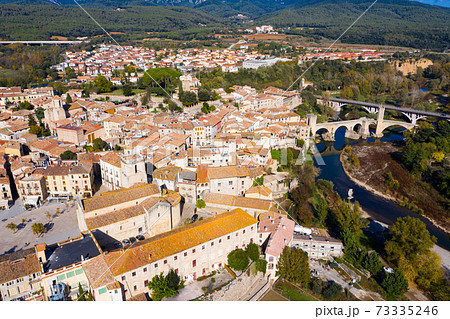Aerial view of Besalu with Romanesque bridge over Fluvia river, Catalonia, Spain Aerial view of Besalu with Romanesque bridge over Fluvia river, Catalonia, Spain 73335246